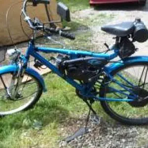 2011 STILL RIDING DAILY pearl blue with ghost flames averaging 100 miles a week this bike goes were I go, powered with a Suzuki JR 50 2 stroke motor,u