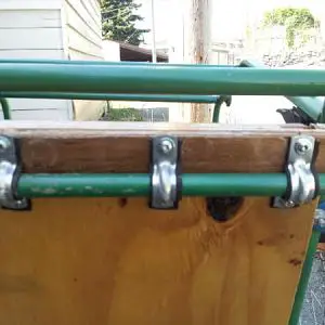 The front and back bars of the trailer are smaller in diameter, and set at a slightly different hieght to the middle bar.  There is a 1/4" plywood shi
