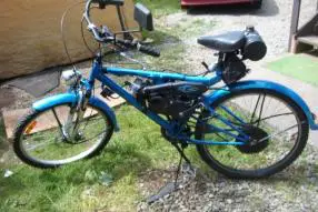 2011 STILL RIDING DAILY pearl blue with ghost flames averaging 100 miles a week this bike goes were I go, powered with a Suzuki JR 50 2 stroke motor,u