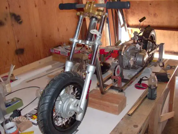 Motorized Scooter frame set-up, changed tires, custom handlebars to low, trying to find a solo chopper seat for cheap, gas tank from motorized bike wi