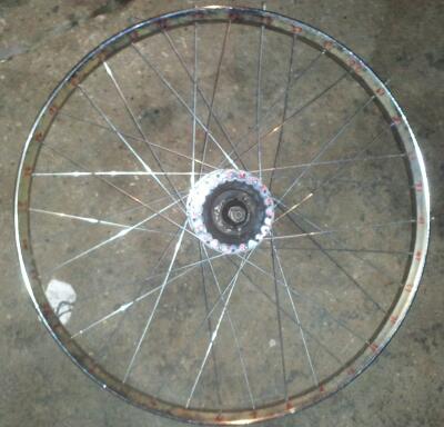 The finished wheel!  11 gauge spokes on a puch hub, going to a m.o manufacturing rim.   Should hold up for a while.