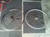 New 36 spoke wheel next to old 32 spoke wheel.jpg