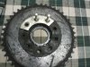 sprocket with old grommet and one metal piece that are right size.jpg
