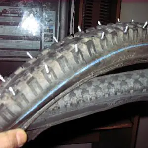 old tire with beads cut off as a liner under the screws, works well.