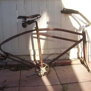 1937 Colson Double Bar Junior. had to cut the cranks and the forks off. the headset and BB had become one with the bike. don't say "you coulda used he