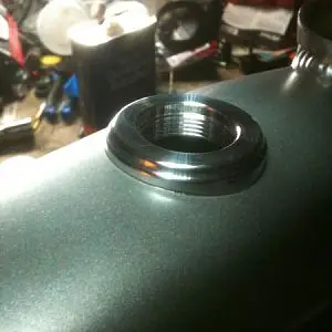 Here is the KW Machine works gas cap kit installed. This is such an awesome product! It fit the frame perfectly and the finish level is amazing. I was