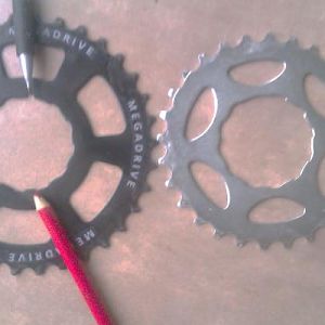You'll need a Sun Race 34 sprocket off an 8 speed 13-34 freewheel.  You'll have to put a notch in the wide spline and file one ramp down.