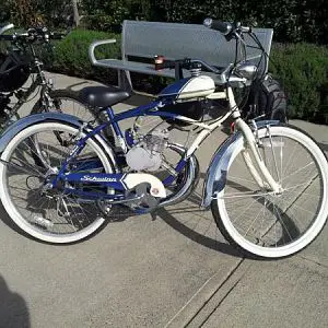 Schwinn 5 Star Cruiser
 
- 6 speed cruiser, gear grip shift swapped to left side.
- 66cc: ports cleaned, piston skirt cut to match intake, head and