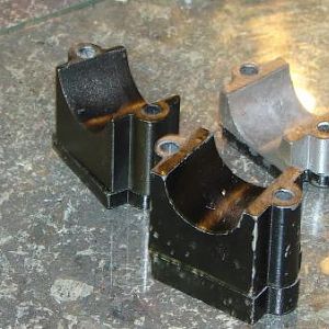 assorted mounts and shims on glass.