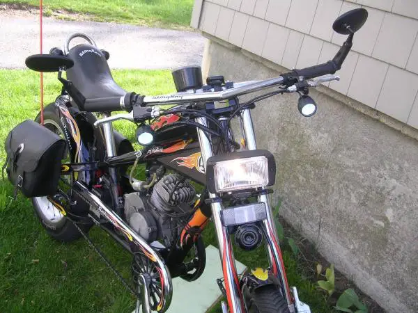 66cc Black s-Ray
Dual lighting, turn signals, brake light, horn, front brakes, dual speedometers, saddle bags, suspension seat and custom motor mount