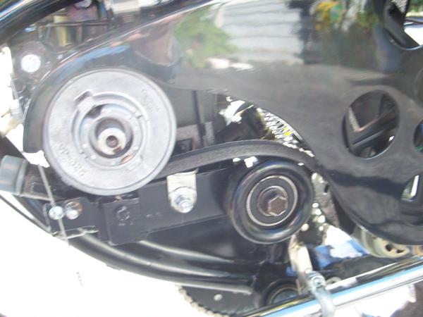 Belt tensioner clutch assembly