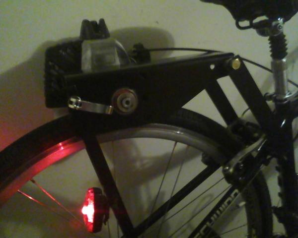 dax CX right side 1

I just drilled a small hole, and used one of the Dax screws and the black nut from the Planet Bike light, to mount it to the mo