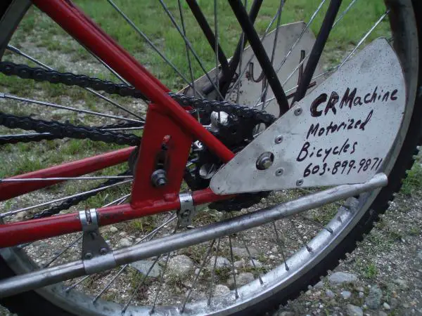 Details showing the main drive tensioner and custom 30 tooth sprocket.