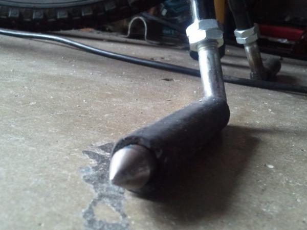 Double jam nuts installed as well as rubber feet. Ends sharpened into spikes.....