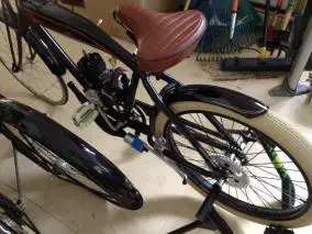 Engine mounts and chain tensioner from KW Machine Works, 44t sprocket and mount from Sportsman Flyer Bikes, and expansion chamber from Sick Bike Parts