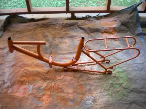 Frame under final Pumpkin Orange coat.