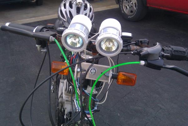 front view of my bike with my 2 homemade halogen lights 20wt's a pc very bright when rideing at night also front blinker set up.