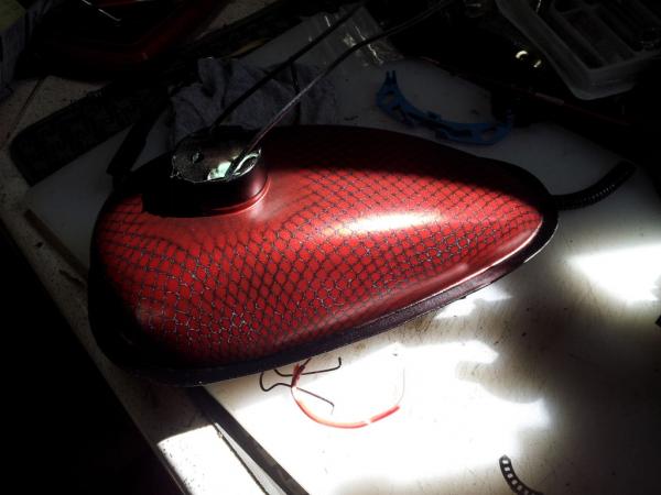 Gas tank, after red paint and clear coating.