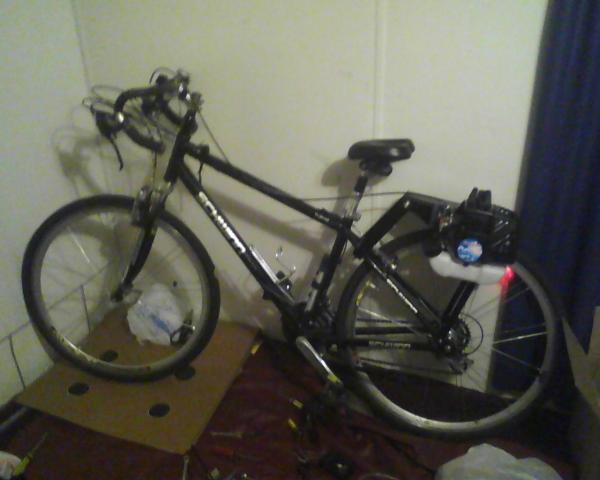 Getting ready to test the bike, using the Remote Throttle and a kill switch glued on the motor mount and grounded under the mounting bolt.
