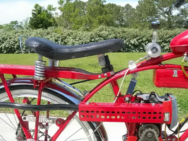 Here is a close up of some of my fabrication work. You can see the stock Homelite clutch, the chain adjuster just in front of the seat post, the Harle