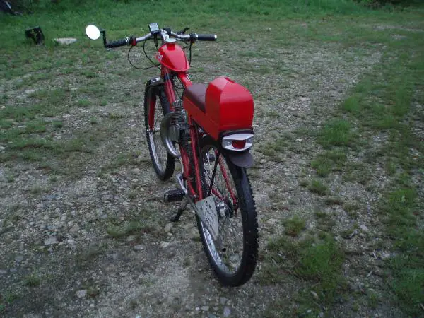 I welded the aluminum parts together, then bolted it to the modified rear rack.