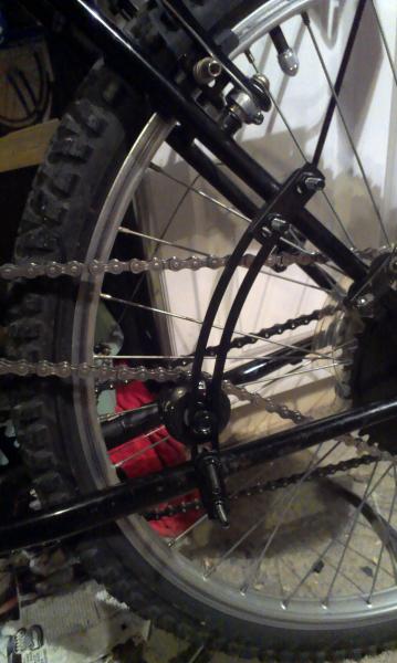 IMAG0955a custommotoredbicycle.com arc tensioner 9.5 inch. i used a skateboard wheel with it.