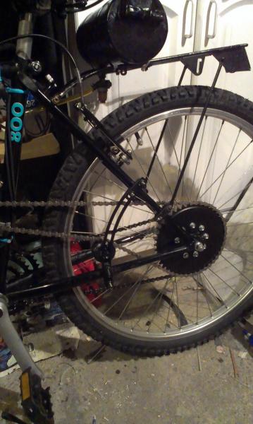 IMAG0955a custommotoredbicycle.com arc tensioner 9.5 inch. i used a skateboard wheel with it.