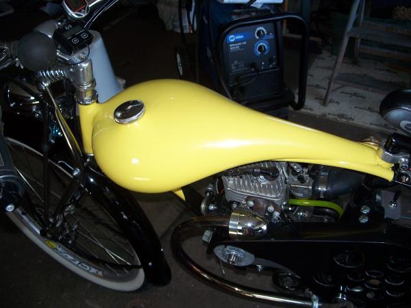 In frame fiberglass fuel tank. Capacity one gallon and one pint.