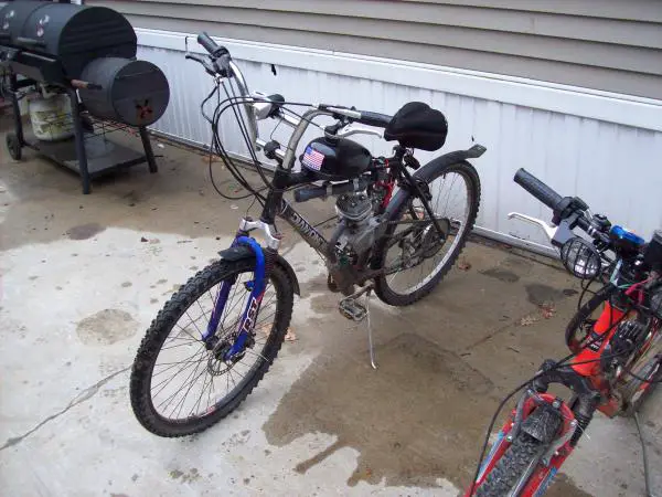 my $120 beater ,just put front forks on with disk brakes I got off a kid in town for $10 with the handle bars