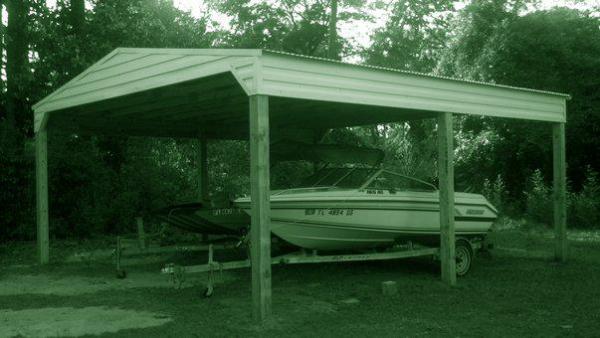 My boats under my new pole barn