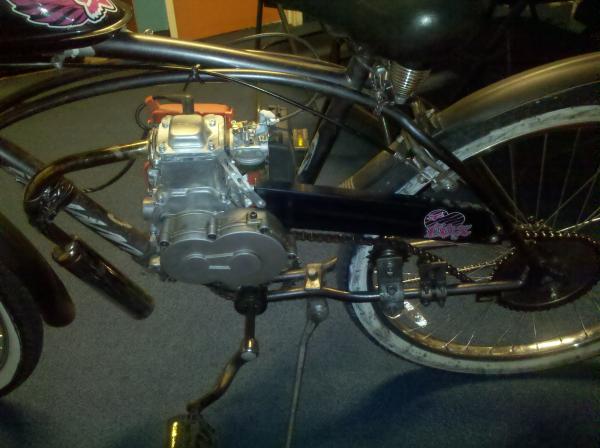 notice the secondary tensioner sprocket - keeps the chain from bashing the tire