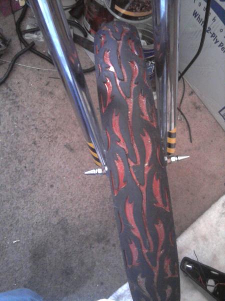 Painted flame tread tires, Axle spikes, 140 spoke wheels, disc brakes ...