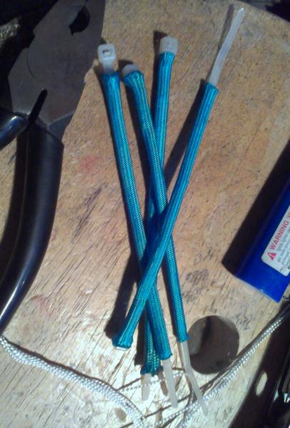 Paracord covered zipties. just tighten and snip