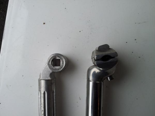 Replacement and Original seat posts, left and right respectively.