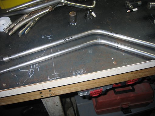 Rods from front axle rocker to spring..these are solid 1/2" rod are bent at 45 deg to spring hangers...this is before I cut them to weld to the spring