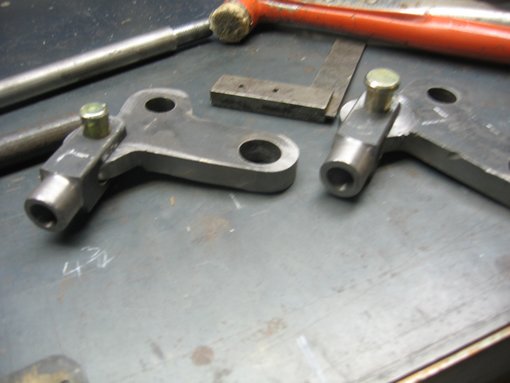 Suspension axle rockers...with adjustable clevis points for the spring rods