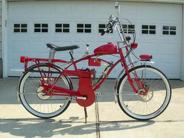 The dual chains are confined in the custom shroud and custom chain guard. The rear wheel sports a 46 tooth sprocket making the final gear ratio of abo