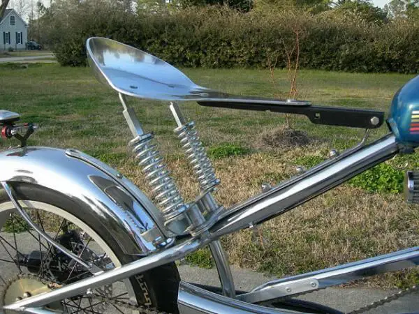 The funky springer seat was fabricated from a large aluminum frying pan from my father-in-laws restaurant. I used the frying pan's handle to mount the