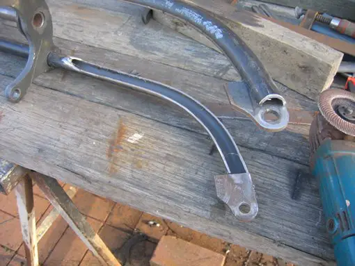 The inside of of fork tubes cut down the middle for wheel and spring lever movement and clearance..shaped 1/8" flat to fill the inside of the fork