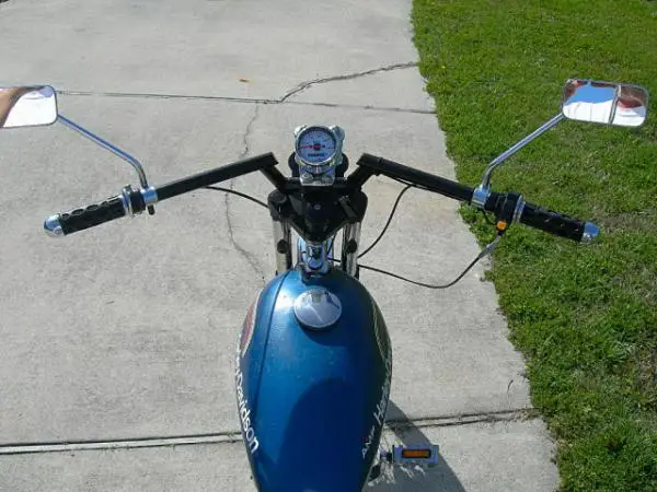 This is the view from the driver's seat. The vintage Harley mirrors are perfect for the setup and the Whizzer speedo red lines over 35MPH.  The Harley