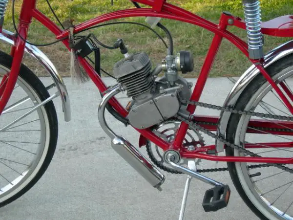 This photo shows the stock Chinagirl that I purchased on Ebay 4 years ago and it's still going strong on another bike. Also shown is a side kickstand,