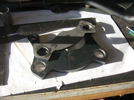 Upper fork profiles with holes cut for fork legs