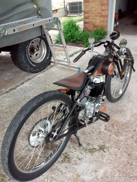 Used a lot of copper, chrome, aluminum and brass. 26" wheels 3" wide on the rear & 2.5" in front. Air spring & shock under that custom leather saddle