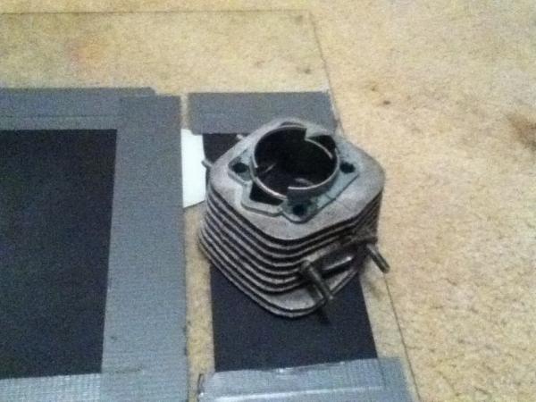 Using a sheet of glass and 800 grit sandpaper to plane the jug.