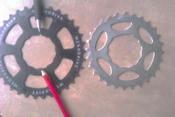 You'll need a Sun Race 34 sprocket off an 8 speed 13-34 freewheel.  You'll have to put a notch in the wide spline and file one ramp down.